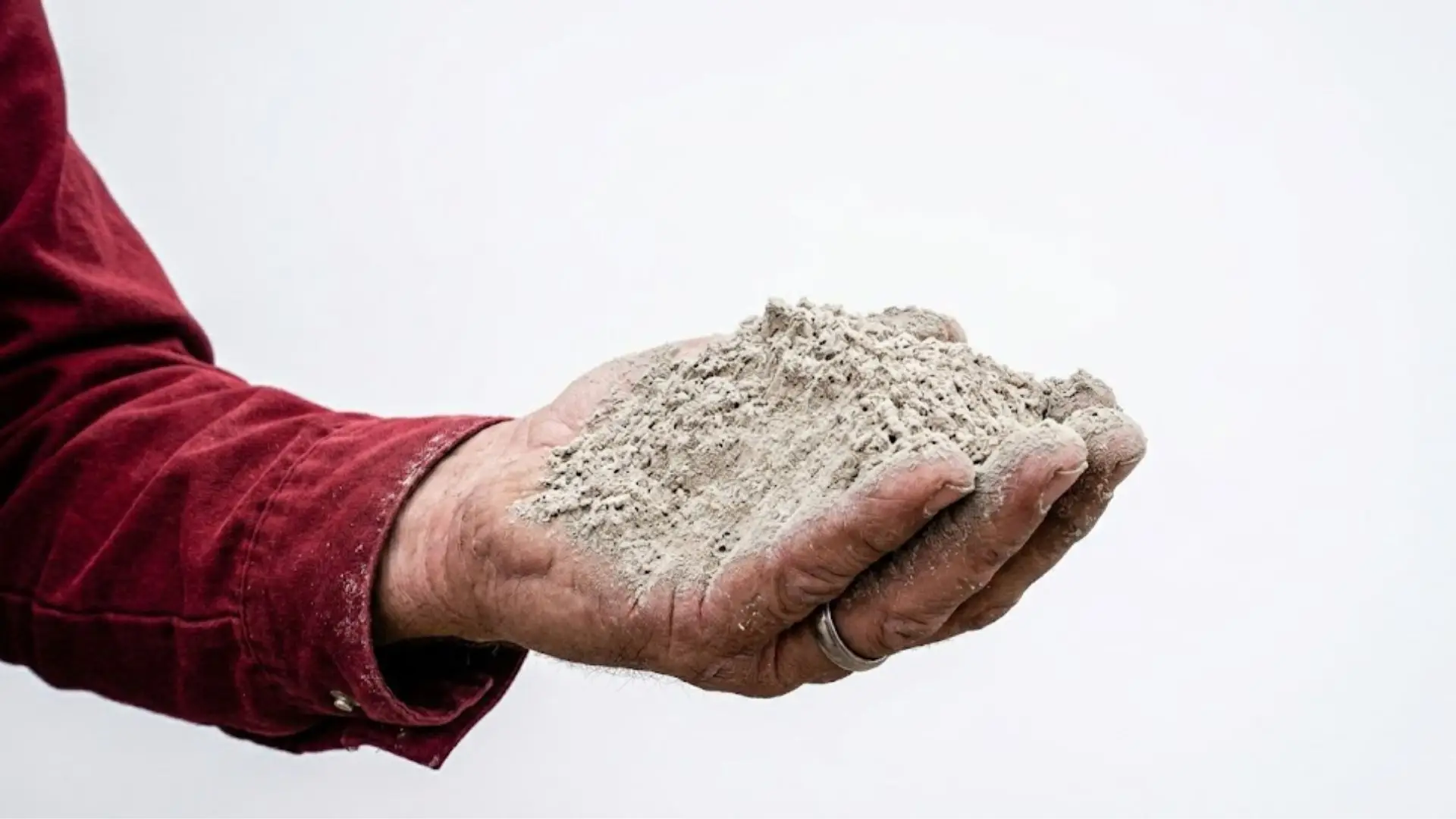 Man holding fly ash cement in hand